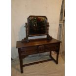 An Oak Dressing Table having separate swing mirror on turned supports,