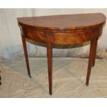 A George III Mahogany Demi Lune Card Table with inlaid banding and stringing,