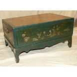 A Reproduction Oriental Green Low Chest depicting figures outside building with all over gilt