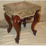 A Victorian Mahogany Stool having floral needlework overstuffed seat on cabriole legs with scroll