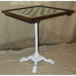 A White Painted Cast Iron Stand mounted with square top inset with glass chess board,
