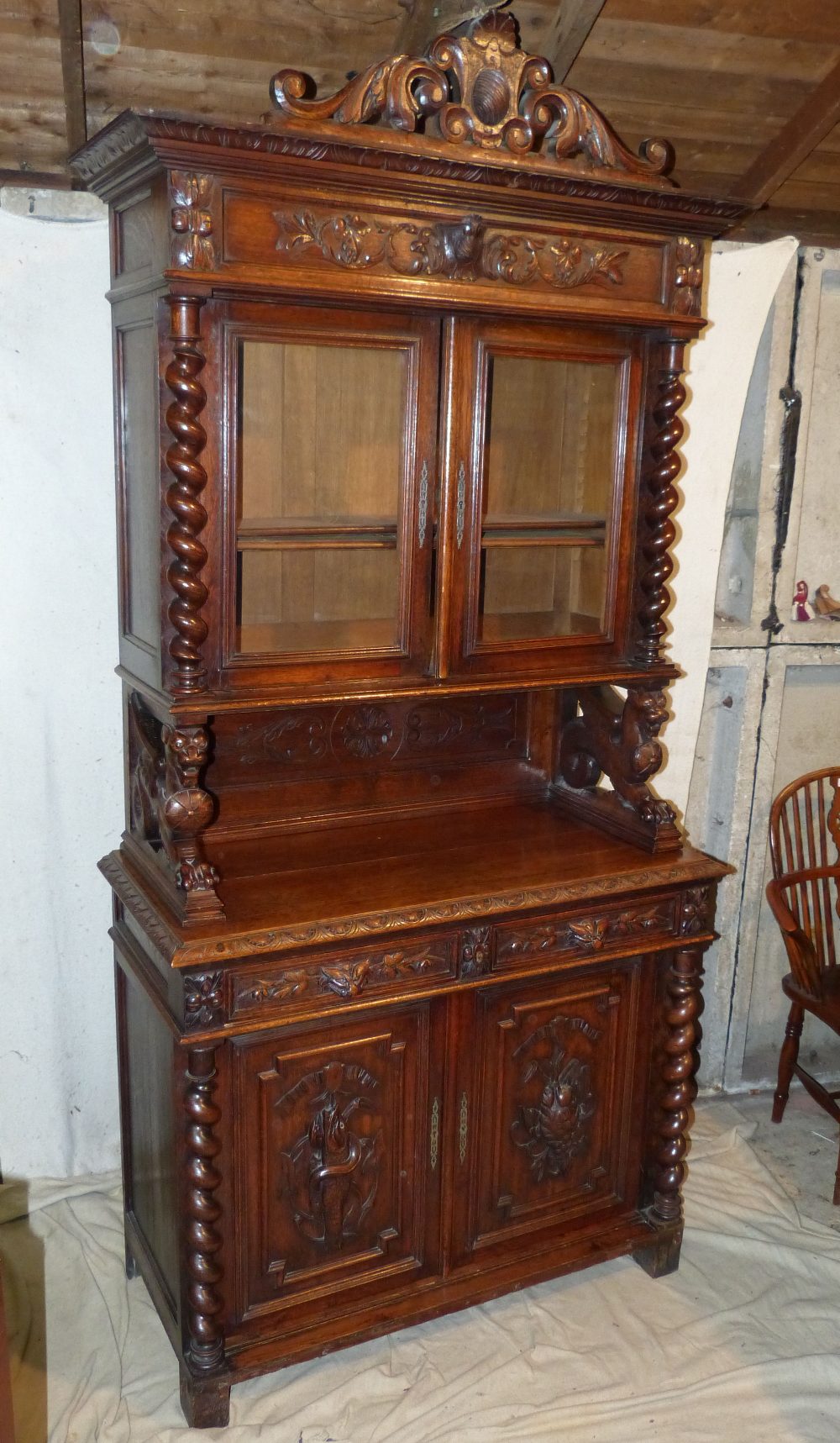 A Victorian Oak Bookcase having all over raised animal, shield, floral and scroll decoration, - Image 2 of 4