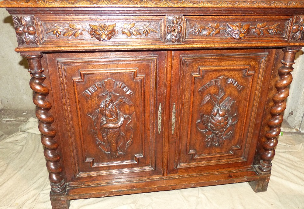 A Victorian Oak Bookcase having all over raised animal, shield, floral and scroll decoration, - Image 4 of 4
