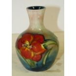 A Moorcroft Small Bulbous Thin Neck Trumpet Shape Vases on cream,