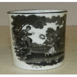 An 18th Century Cup on white ground having black decoration of children playing in garden with