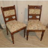 A Set of 4 Oak Single Chairs having carved floral and leaf decoration,