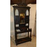 A Victorian Carved Oak Hall Stand having raised mask head, fruit, leaf and scroll decoration,