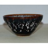 An Oriental Earthenware Round Trumpet Shaped Tea Bowl on white and brown ground having leaf