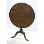 A late Georgian oak circular occasional