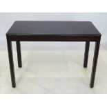 A Gordon Russell dark mahogany table, of