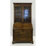 A reproduction mahogany bureau bookcase,