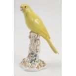 A Royal Worcester model, Canary, on a gilt and white stump decorated with flowers, model number 2665