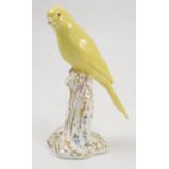 A Royal Worcester model, Canary, on a gilt and white stump decorated with flowers, model number 2665