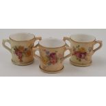 Three Royal Worcester miniature three handled tygs, all decorated with flowers, various dates,