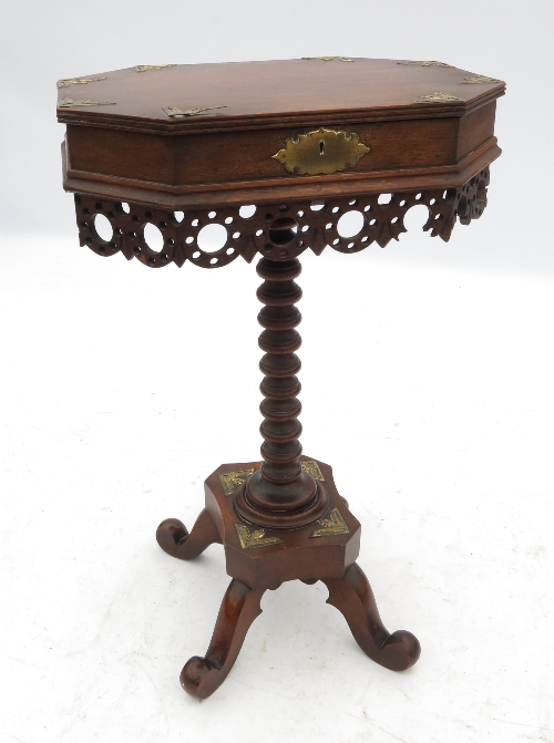 An octagonal topped work table, with ris