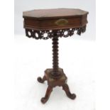 An octagonal topped work table, with ris