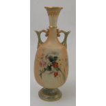 A Royal Worcester blush ivory vase, with green neck, handles and pedestal foot, decorated with