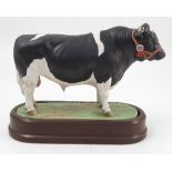 A Royal Worcester model, British Fresian Bull, modelled by Doris Lindner, circa 1964, with wooden