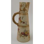 A Royal Worcester claret jug, with moulded handle, decorated with flowers, dated 1902, height 10.