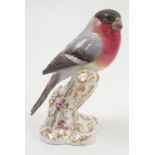 A Royal Worcester model, Bullfinch, on a gilt and white stump decorated with flowers, model number