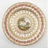 A 19th century Derby porcelain plate, decorated with a titled view 'Near Southampton', with