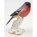 A Royal Worcester model, Bullfinch, on a gilt and white stump, model number 2662, dated 1919