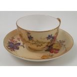 A Royal Worcester blush ivory tea cup and saucer, decorated with floral sprays, dated 1908 Condition