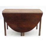 A Georgian mahogany oval gate leg table,