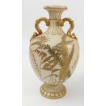 A 19th century Royal Worcester blush ivory vase, decorated with gilt ferns, having snake handles and