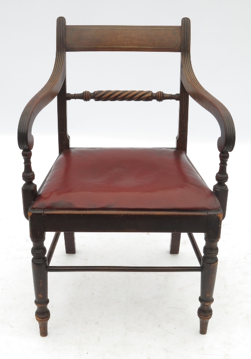 A Regency style mahogany scroll armchair