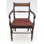 A Regency style mahogany scroll armchair