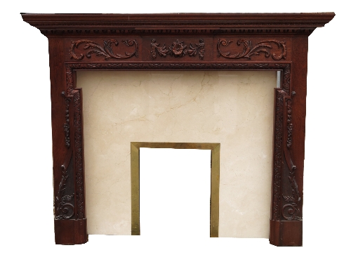 An oak fireplace, with carved swags and