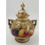 A Royal Worcester covered pot pourri, decorated to the front with hand painted fruit to a mossy