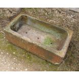 A rectangular stoneware sink, with brown