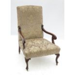 A mahogany open armchair, raised on fron