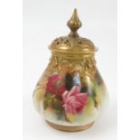 A Royal Worcester covered vase, with gilt pierced covers, the quarter lobed body hand painted with