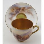 A Royal Worcester cabinet cup and saucer, hand painted with Highland cattle in a landscape to the