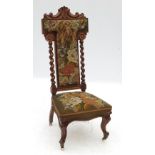 A 19th century oak prie deux chair, with