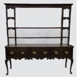 An 18th century oak dresser, with associ