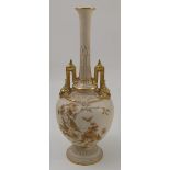 A Royal Worcester ivory vase, decorated with gilt flowers and insects to gilt dolphin handles, dated