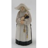 A Royal Worcester candle snuffer, modelled as The Nun, dated 1925, height 3.75ins Condition