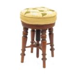 A 19th century circular piano stool, rai