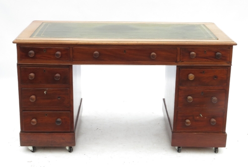 A 19th century mahogany desk, fitted thr