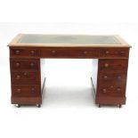 A 19th century mahogany desk, fitted thr