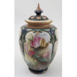 A Hadleys Worcester covered vase, the body divided into panels and decorated with flowers and