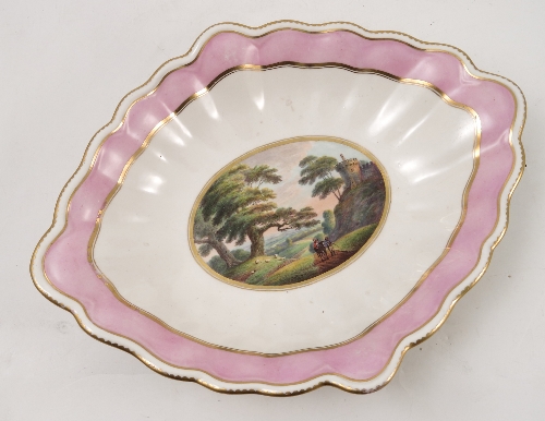 A 19th century Derby porcelain oval dish, painted with figures on a path in a landscape, with pink