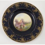 A Royal Worcester cabinet plate, hand painted with a cottage and flower garden, by Ball?, to a