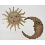 A pair of 18th century cut brass sun and moon signs, with original painted faces, heights 11.5ins