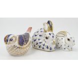 Three Royal Crown Derby paper weights, modelled as a bird and two rabbits, 1986 and 1990,