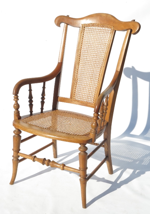 A 19th century cane seated mahogany armchair,